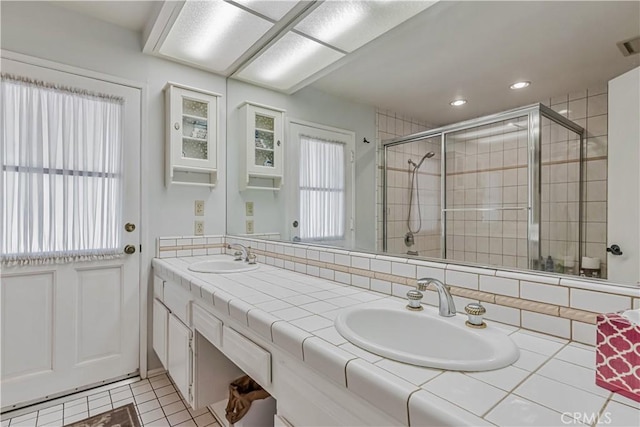 19628 Pine Valley Ave, Porter Ranch, CA 91326 - full bath with double vanity, a stall shower, tile patterned flooring, and recessed lighting