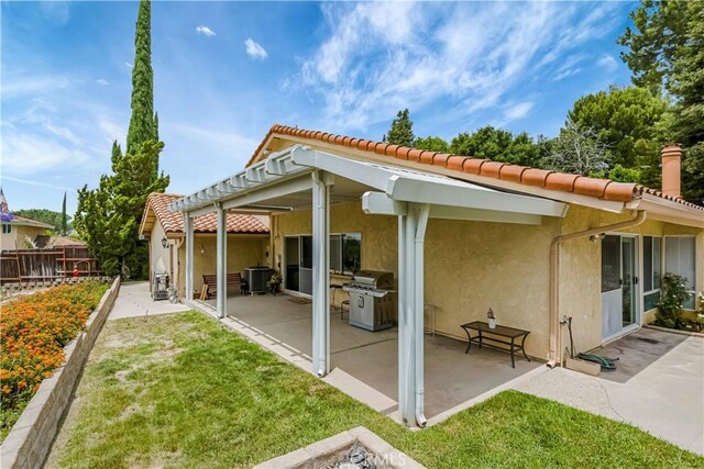 19628 Pine Valley Ave, Porter Ranch, CA 91326 - rear view of house featuring a patio, a tile roof, and stucco siding