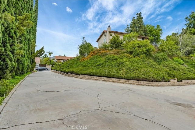 19628 Pine Valley Ave, Porter Ranch, CA 91326 - view of concrete driveway