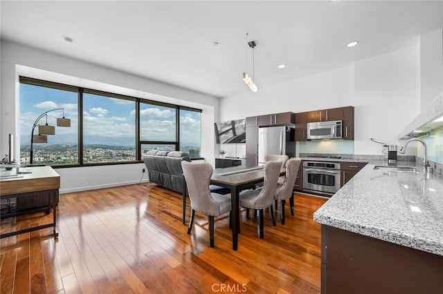 1100 Wilshire Blvd Unit 3005, Los Angeles, CA 90017 - dining space featuring hardwood / wood-style floors, recessed lighting, and baseboards