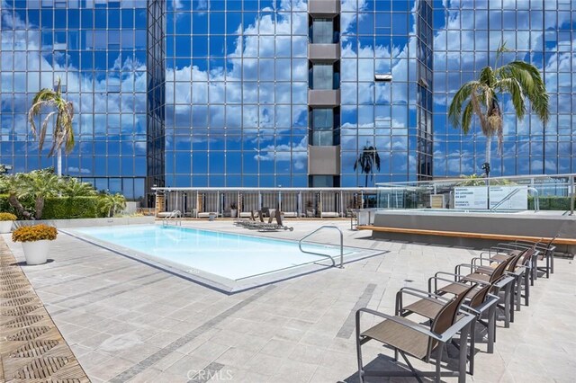 1100 Wilshire Blvd Unit 3005, Los Angeles, CA 90017 - community pool featuring a patio