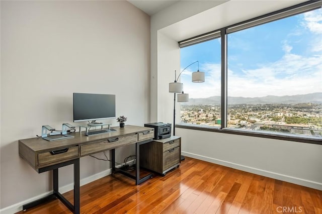 1100 Wilshire Blvd Unit 3005, Los Angeles, CA 90017 - office featuring baseboards, healthy amount of natural light, and hardwood / wood-style floors