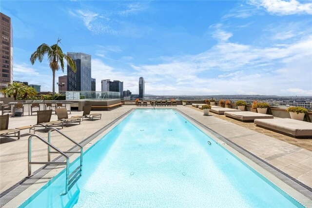 1100 Wilshire Blvd Unit 3005, Los Angeles, CA 90017 - community pool featuring a patio and a view of city