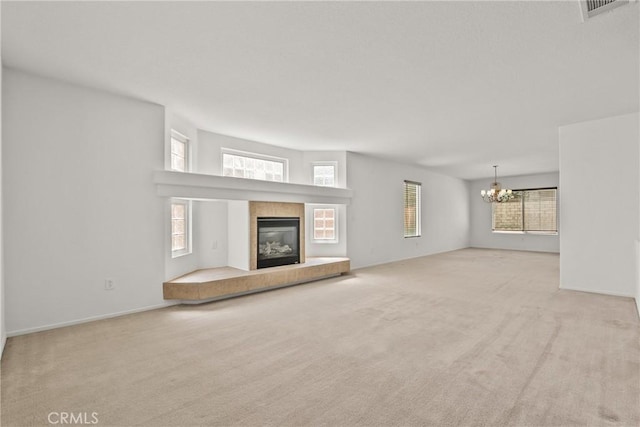 5564 Capri Ct, Palmdale, CA 93552 - unfurnished living room featuring a chandelier, carpet, and healthy amount of natural light