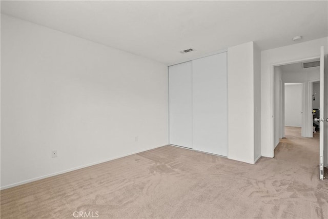 5564 Capri Ct, Palmdale, CA 93552 - unfurnished bedroom with light colored carpet, a closet, and baseboards