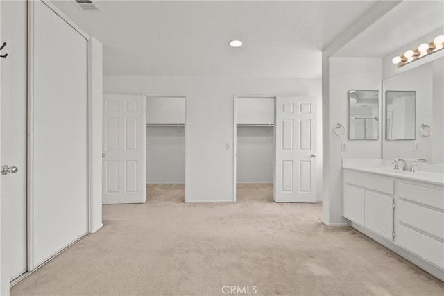 5564 Capri Ct, Palmdale, CA 93552 - bathroom featuring vanity, carpet, baseboards, and recessed lighting