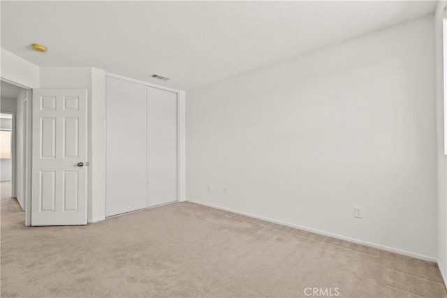 5564 Capri Ct, Palmdale, CA 93552 - unfurnished bedroom with light colored carpet, a closet, and baseboards