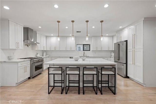 2048 W Kenneth Rd, Glendale, CA 91201 - kitchen featuring high quality appliances, wall chimney range hood, a sink, a kitchen breakfast bar, and a kitchen island