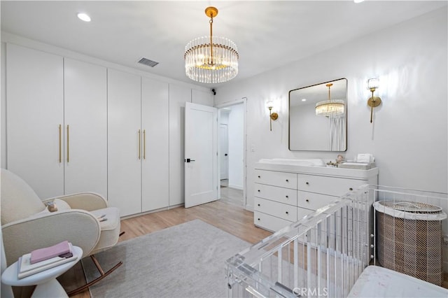 2048 W Kenneth Rd, Glendale, CA 91201 - bedroom featuring light wood-style floors, a chandelier, a crib, and recessed lighting