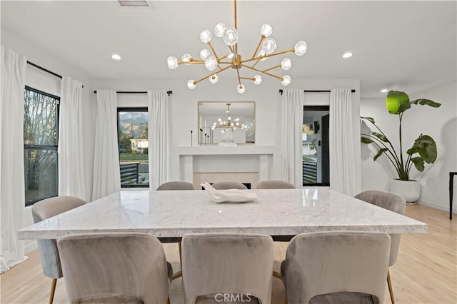 2048 W Kenneth Rd, Glendale, CA 91201 - dining area featuring a chandelier, light wood-type flooring, baseboards, and recessed lighting