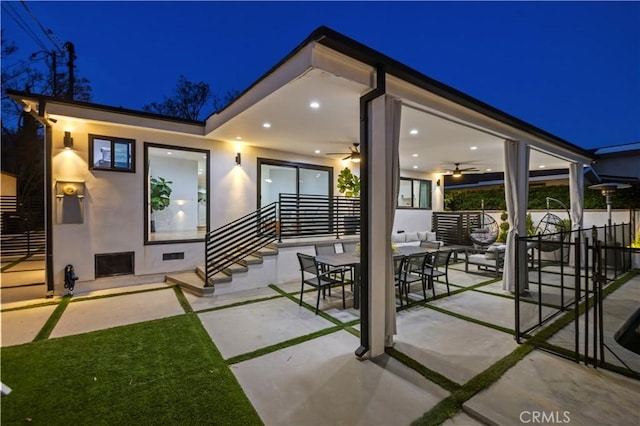 2048 W Kenneth Rd, Glendale, CA 91201 - patio at twilight with ceiling fan, fence, and outdoor lounge area