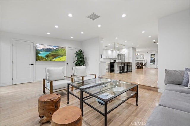 2048 W Kenneth Rd, Glendale, CA 91201 - living room featuring wine cooler, light wood-style floors, recessed lighting, and baseboards