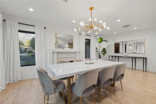2048 W Kenneth Rd, Glendale, CA 91201 - dining space with a chandelier, light wood finished floors, recessed lighting, and baseboards