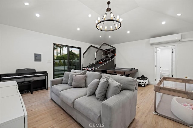2048 W Kenneth Rd, Glendale, CA 91201 - living room with an AC wall unit, lofted ceiling, recessed lighting, light wood-type flooring, and a chandelier