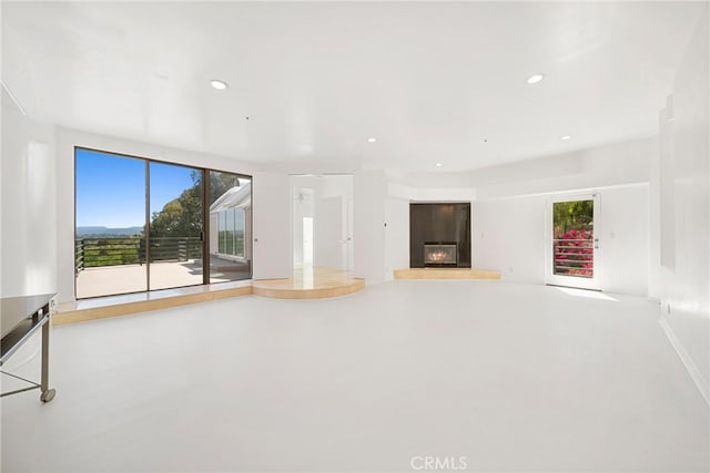 9314 Stevens Way, West Hills, CA 91304 - unfurnished living room with a glass covered fireplace, plenty of natural light, and recessed lighting