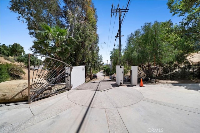 9314 Stevens Way, West Hills, CA 91304 - view of concrete surface featuring a gate