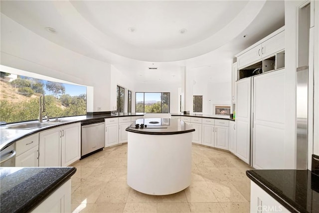 9314 Stevens Way, West Hills, CA 91304 - kitchen with stainless steel dishwasher, a sink, a peninsula, white cabinets, and a kitchen island