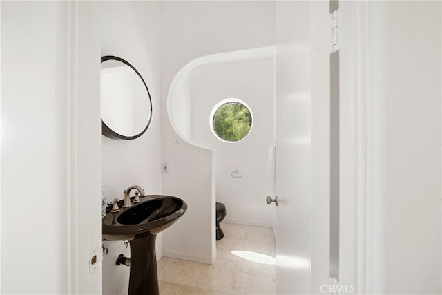 9314 Stevens Way, West Hills, CA 91304 - half bathroom with toilet, a sink, and baseboards