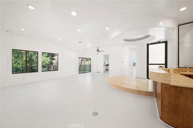 9314 Stevens Way, West Hills, CA 91304 - unfurnished living room with recessed lighting, ceiling fan, and concrete flooring
