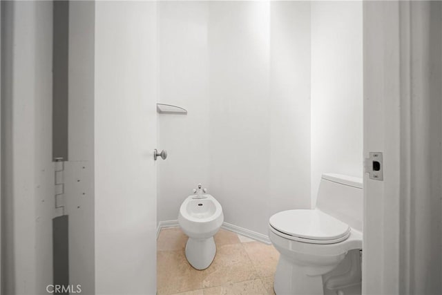 9314 Stevens Way, West Hills, CA 91304 - bathroom with a bidet, toilet, and baseboards