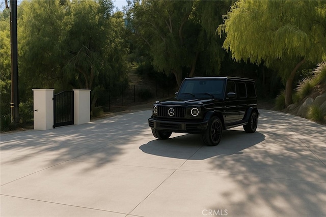 9314 Stevens Way, West Hills, CA 91304 - view of concrete driveway with a gate