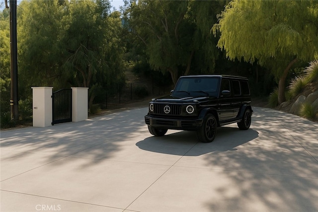 9314 Stevens Way, West Hills, CA 91304 - view of concrete driveway with a gate