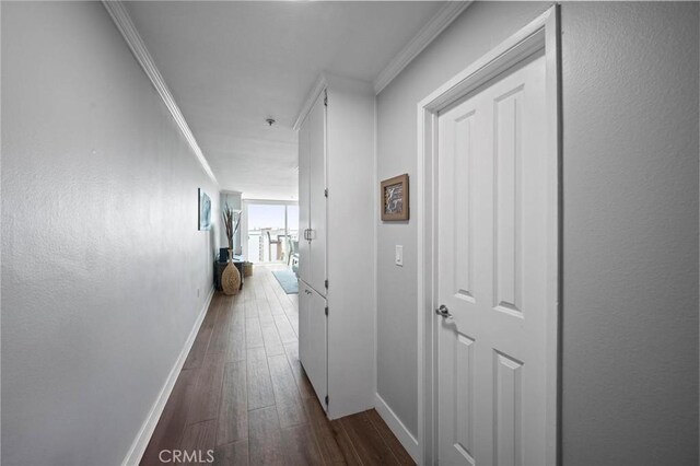 615 Esplanade Unit 509, Redondo Beach, CA 90277 - hall with baseboards, dark wood-style flooring, and crown molding