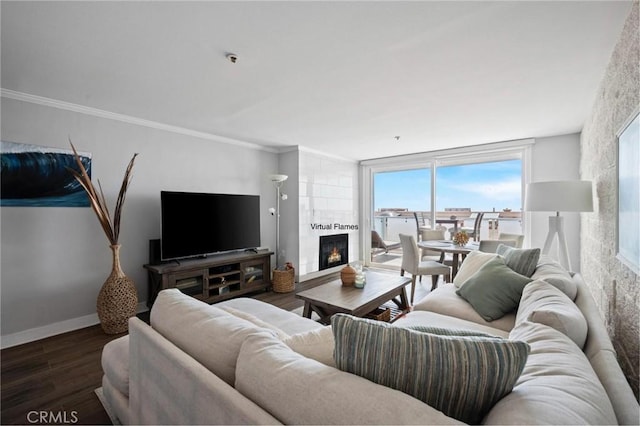 615 Esplanade Unit 509, Redondo Beach, CA 90277 - living room featuring wood finished floors, a tile fireplace, plenty of natural light, ornamental molding, and baseboards
