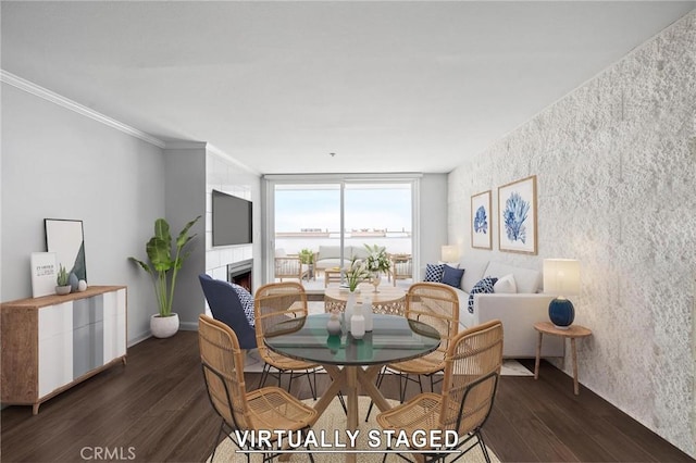 615 Esplanade Unit 509, Redondo Beach, CA 90277 - dining area with wood finished floors, a warm lit fireplace, and crown molding