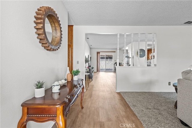 2210 El Rancho Cir, Hemet, CA 92545 - corridor with wood finished floors and a textured ceiling