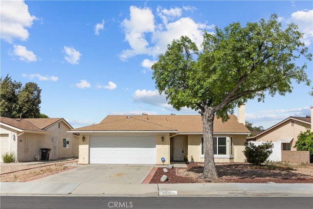 2210 El Rancho Cir, Hemet, CA 92545 - ranch-style house with concrete driveway, stucco siding, a garage, and a chimney