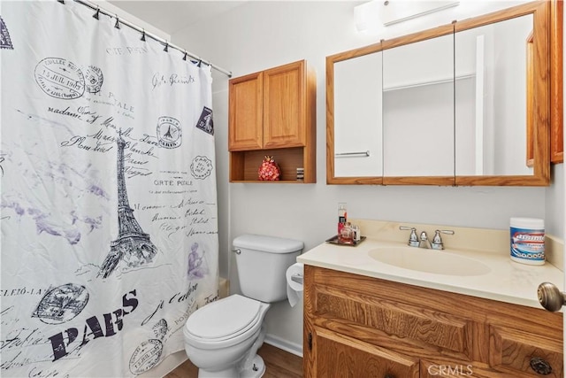 2210 El Rancho Cir, Hemet, CA 92545 - full bathroom with vanity, toilet, wood finished floors, and a shower with shower curtain