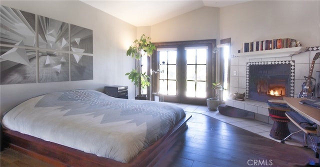 715 Windsong Ln, Nipomo, CA 93444 - bedroom with hardwood / wood-style floors, lofted ceiling, and a fireplace
