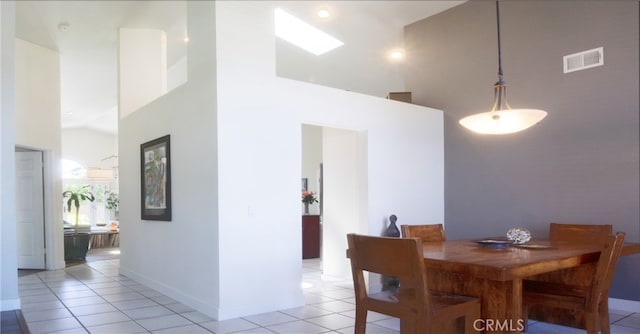 715 Windsong Ln, Nipomo, CA 93444 - dining space featuring light tile patterned floors, high vaulted ceiling, and baseboards