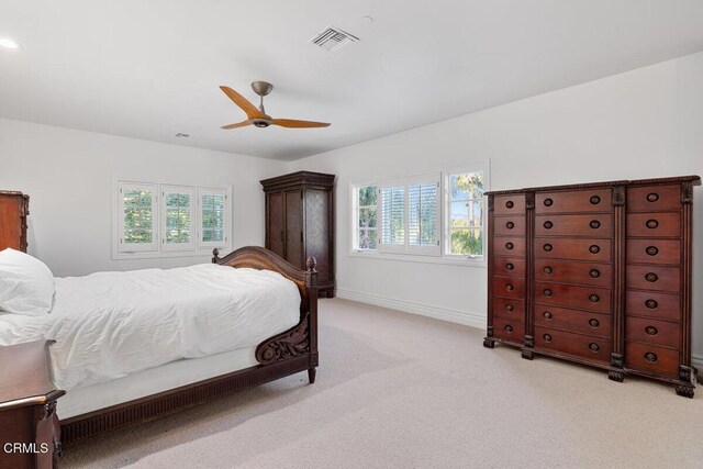 12986 Macdonald Dr, Ojai, CA 93023 - bedroom featuring light colored carpet, multiple windows, a ceiling fan, and baseboards