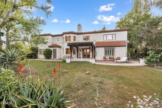 12986 Macdonald Dr, Ojai, CA 93023 - back of house featuring a pergola, a chimney, a patio area, a tile roof, and stucco siding