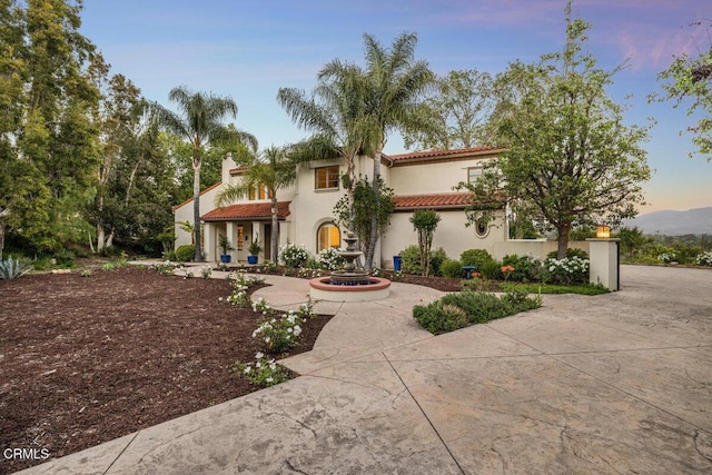 12986 Macdonald Dr, Ojai, CA 93023 - mediterranean / spanish house with a tile roof, stucco siding, and curved driveway