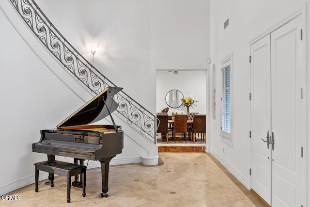12986 Macdonald Dr, Ojai, CA 93023 - foyer featuring a towering ceiling, stairs, and baseboards