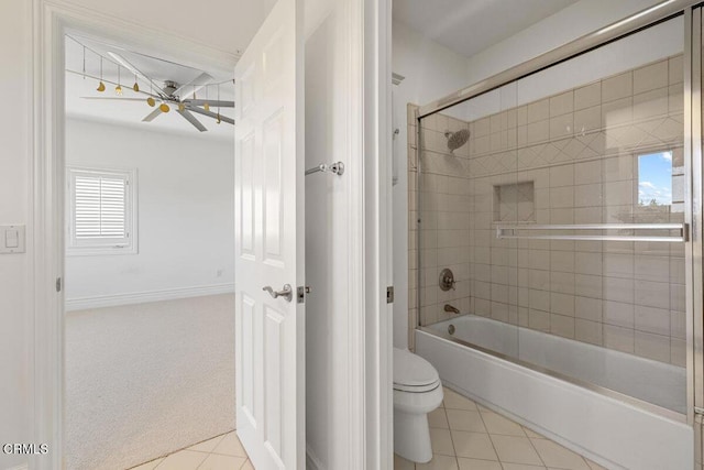 12986 Macdonald Dr, Ojai, CA 93023 - bathroom with toilet, tile patterned flooring, shower / bath combination with glass door, a ceiling fan, and baseboards