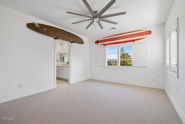 12986 Macdonald Dr, Ojai, CA 93023 - spare room featuring a ceiling fan, light colored carpet, and baseboards