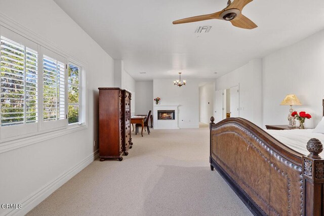 12986 Macdonald Dr, Ojai, CA 93023 - carpeted bedroom featuring a chandelier, baseboards, and a lit fireplace