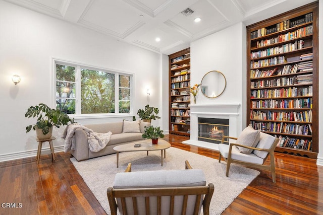 12986 Macdonald Dr, Ojai, CA 93023 - living room featuring built in shelves, baseboards, a glass covered fireplace, wood-type flooring, and coffered ceiling