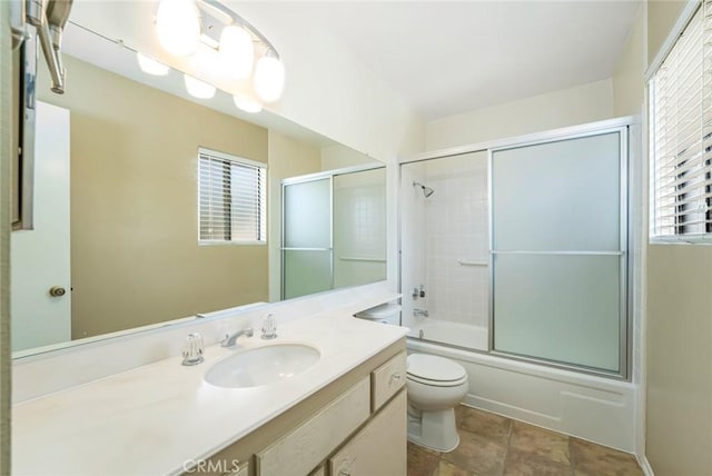 917 W Imperial Unit 64, La Habra, CA 90631 - bathroom with toilet, vanity, bath / shower combo with glass door, and plenty of natural light