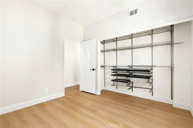 21 Medici Aisle, Irvine, CA 92606 - bedroom with baseboards and light wood-style flooring