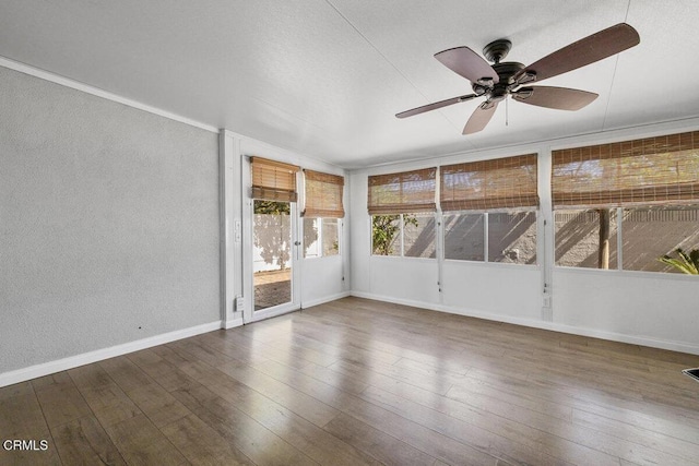 203 E Garden Grn, Port Hueneme, CA 93041 - unfurnished sunroom featuring ceiling fan, a textured wall, wood finished floors, and baseboards