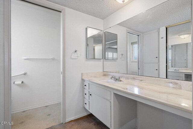 203 E Garden Grn, Port Hueneme, CA 93041 - full bathroom with a textured ceiling, baseboards, and vanity