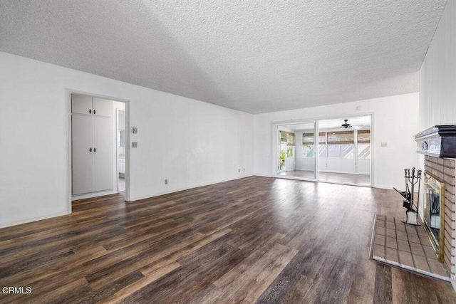 203 E Garden Grn, Port Hueneme, CA 93041 - unfurnished living room with a fireplace, dark wood finished floors, a textured ceiling, and ceiling fan