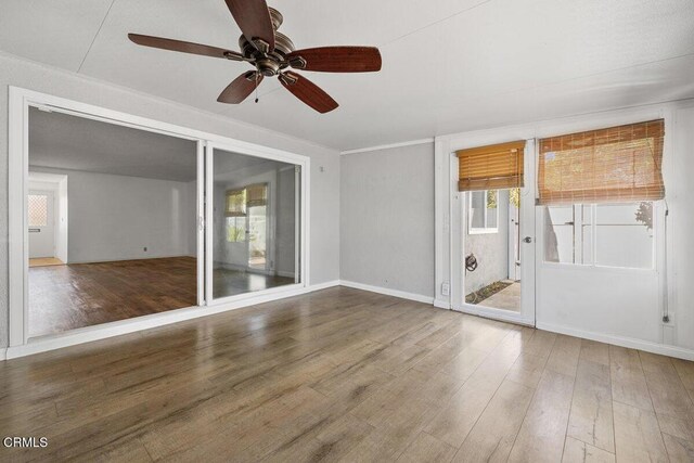 203 E Garden Grn, Port Hueneme, CA 93041 - unfurnished room featuring healthy amount of natural light, ceiling fan, and wood finished floors
