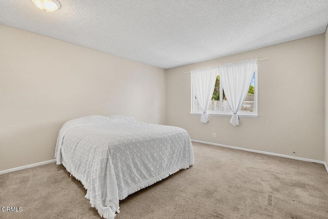 203 E Garden Grn, Port Hueneme, CA 93041 - carpeted bedroom featuring a textured ceiling and baseboards