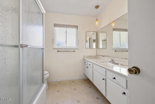 203 E Garden Grn, Port Hueneme, CA 93041 - bathroom featuring vanity, baseboards, toilet, tile patterned flooring, and an enclosed shower